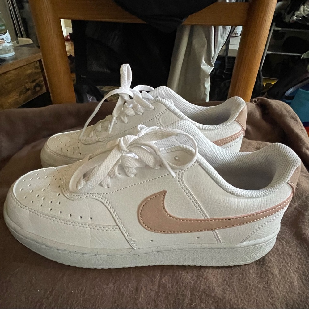 white and pink Nikes